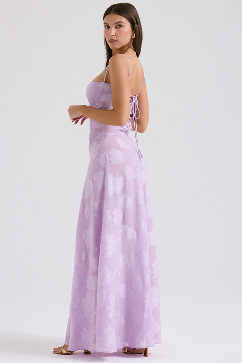 Three-quarter back view of the lavender floral maxi dress, showing the delicate lace-up detail on the back bodice.