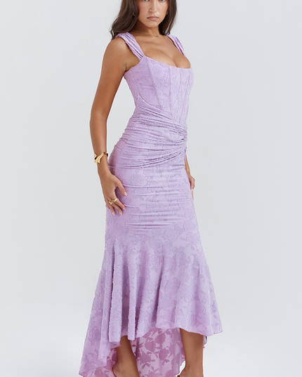 Side profile of the light purple floral ruched off-shoulder maxi dress, showcasing the elegant fit and flare high-low silhouette.