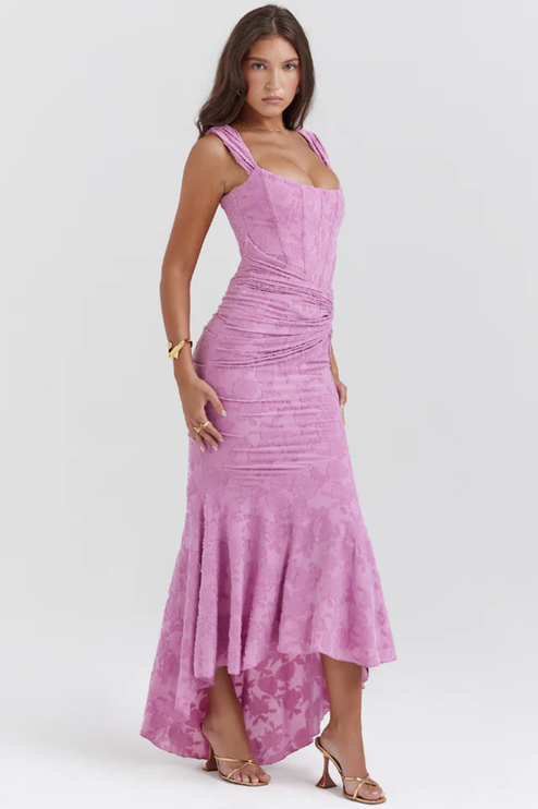 Side view of the pink floral ruched off-shoulder maxi dress, showing the elegant drape and textured floral fabric.