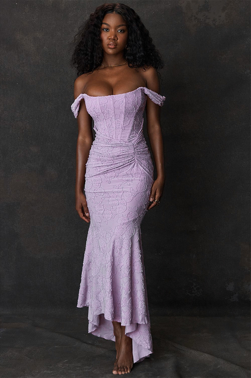 Full-length view of a women's floral ruched off-shoulder maxi dress in a light lavender color with a sweetheart neckline and mermaid hem.