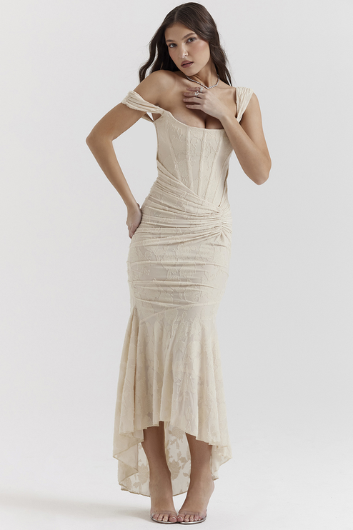 Cream floral ruched off-shoulder maxi dress with a corset bodice and high-low hem, shown from the front.