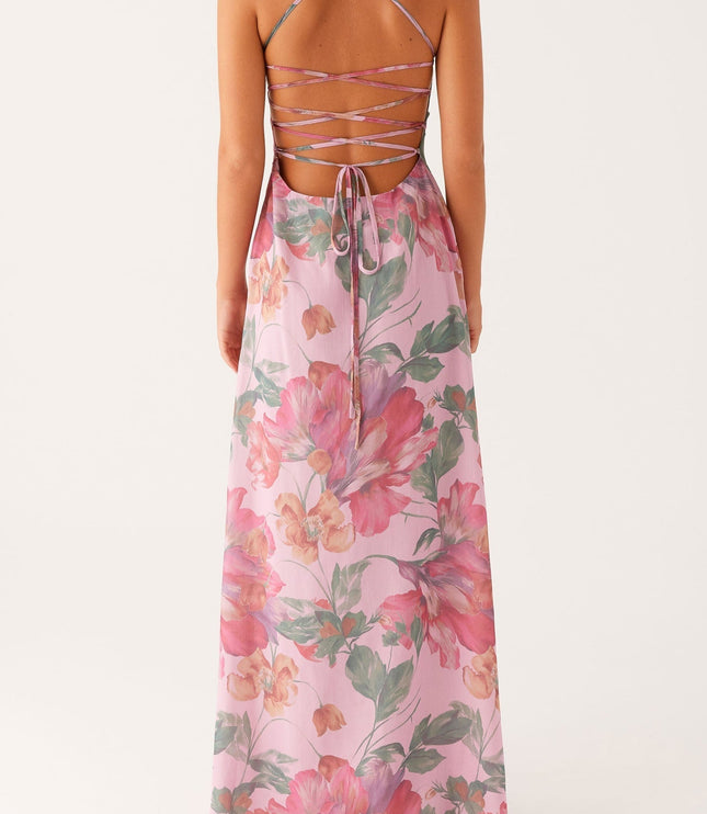 Detailed back view of the women's pink floral maxi dress, focusing on the criss cross strap design.