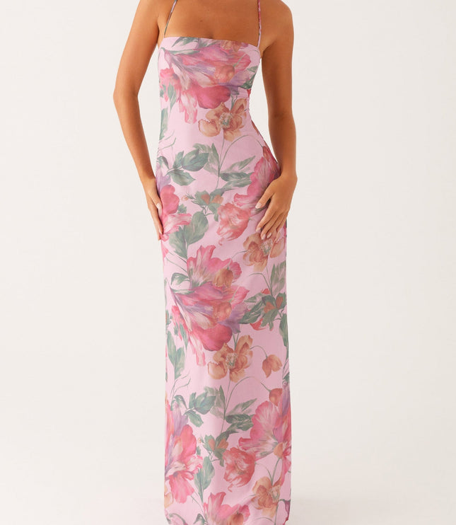 Front view of a women's pink floral square neck maxi dress with thin straps and a flowing skirt.