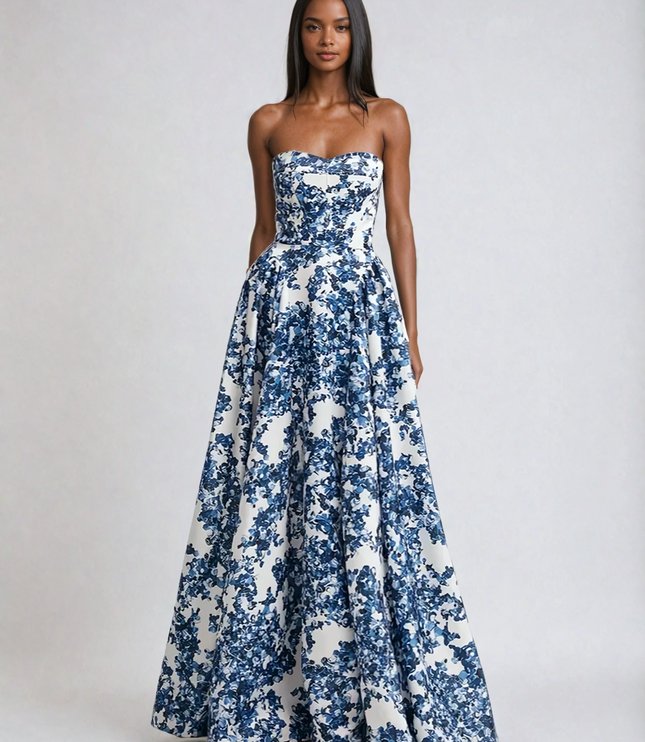 Front view of a women's elegant strapless floral maxi dress in a vibrant blue and white pattern, suitable for formal events.