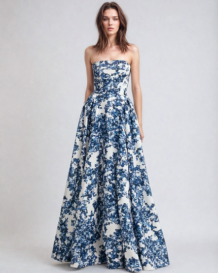 Women's blue and white floral strapless formal maxi dress, showcasing the full skirt and fitted bodice design.
