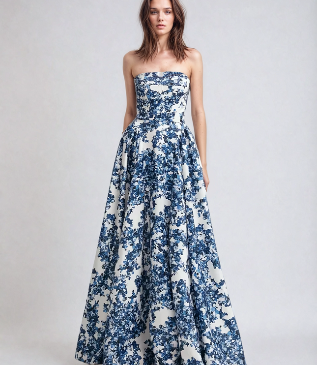 Women's blue and white floral strapless formal maxi dress, showcasing the full skirt and fitted bodice design.
