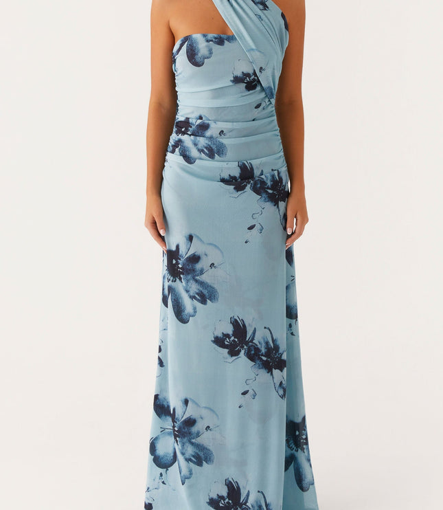 Front view of women's light blue floral maxi dress, featuring a strapless ruched bodice and a flowing skirt with dark blue flowers.