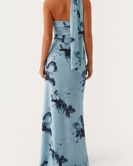 Back view of the light blue floral strapless ruched maxi dress, highlighting the back and the draped fabric detail.
