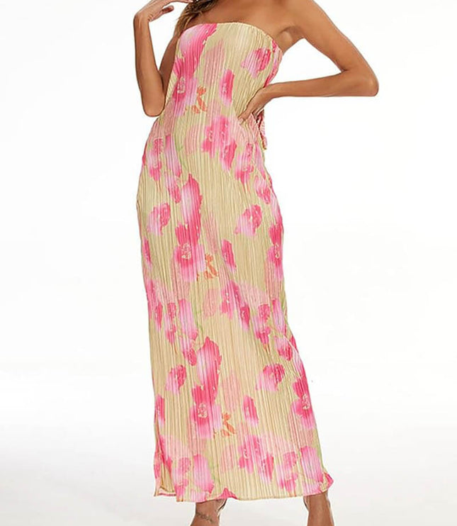 Side view of a women's strapless pleated maxi dress in a pink floral pattern, highlighting the flowy silhouette.