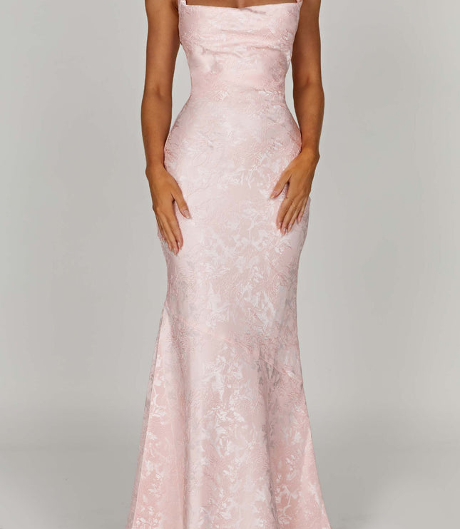 Full-length women's pink floral maxi dress with tie straps and off-shoulder neckline, featuring a fitted bodice and flowing skirt.