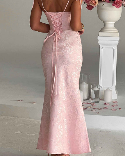 Back view of the pink floral maxi dress, featuring a stylish lace-up corset detail and delicate tie straps.
