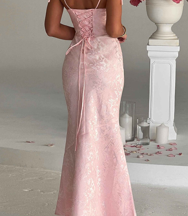 Back view of the pink floral maxi dress, featuring a stylish lace-up corset detail and delicate tie straps.
