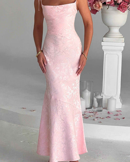 Full-length front view of the pink floral maxi dress with tie straps, showcasing its fit and subtle pattern.