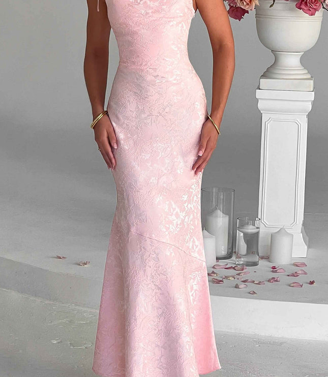 Full-length front view of the pink floral maxi dress with tie straps, showcasing its fit and subtle pattern.