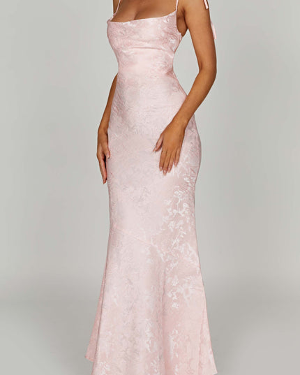 Side profile of the women's pink floral maxi dress, showing the elegant cut and tie-shoulder details.