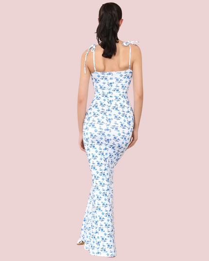 Back view of women's floral tie-strap sleeveless maxi dress, showing fitted silhouette