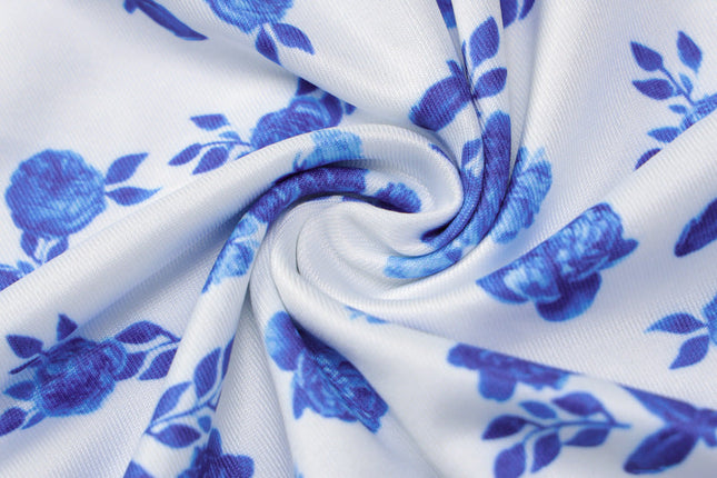 Fabric swatch of the women's floral maxi dress, highlighting white material with blue flower print