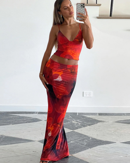 Women's red floral V-neck crop top and maxi skirt set, full length, with a vibrant red and orange flower print.