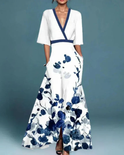 Women's white floral v-neck maxi dress with short sleeves and blue abstract floral print, with pockets visible.