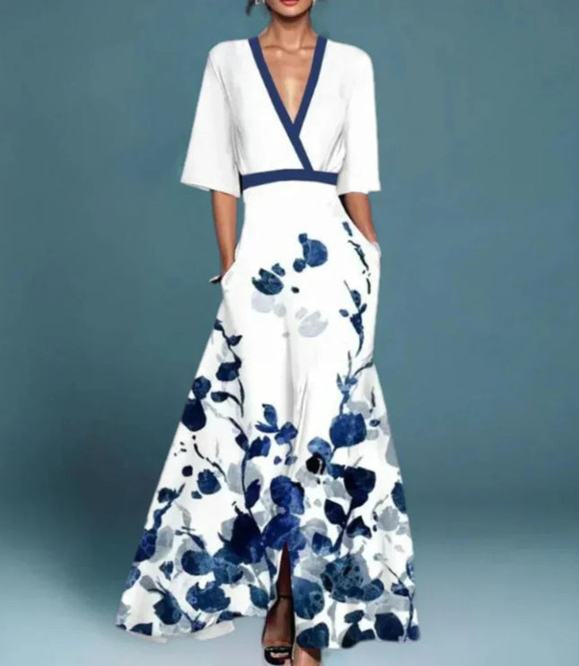 Women's white floral v-neck maxi dress with short sleeves and blue abstract floral print, with pockets visible.