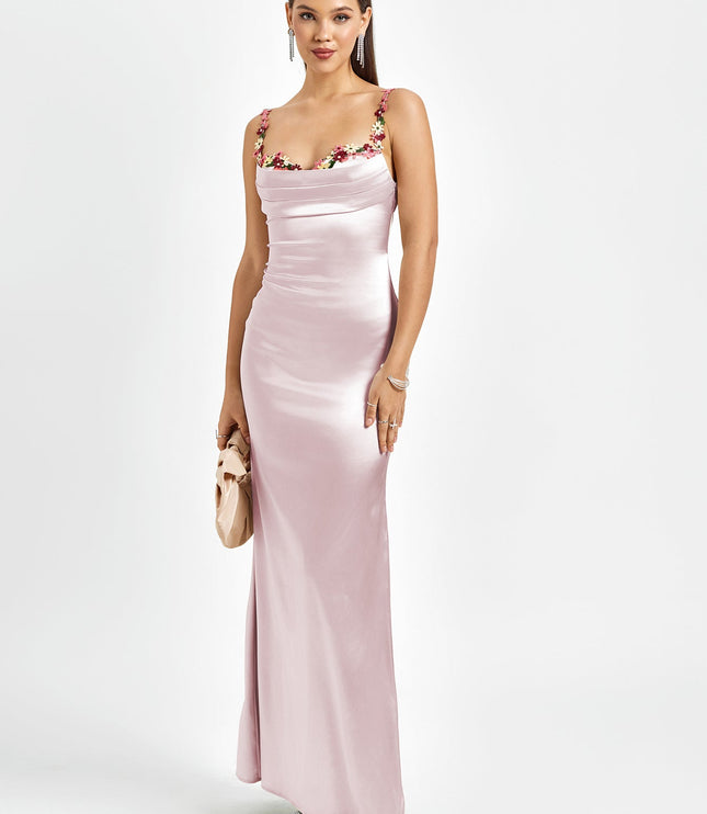 Elegant pink satin maxi dress for women, featuring a floral cowl neck, delicate straps, and a small clutch.