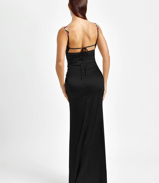 Back view of a black formal maxi dress featuring floral embroidered straps and an open back with tie closures.