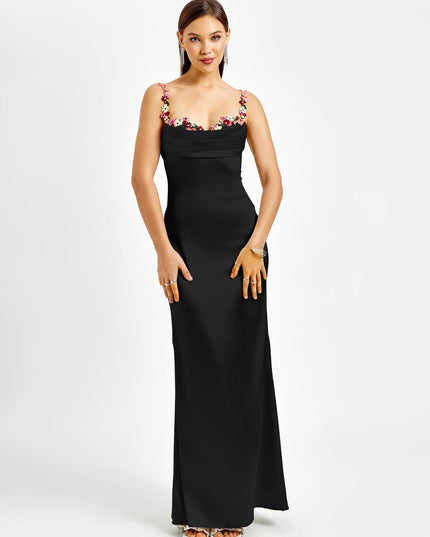 Front view of a black formal maxi dress with a sophisticated cowl neck and vibrant floral embroidered straps.