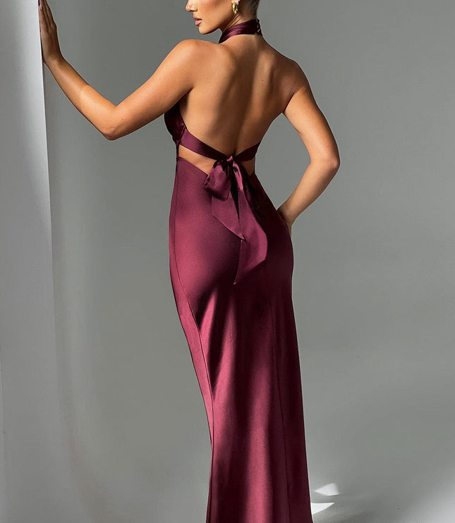 Rear view of a formal burgundy maxi dress with a low back and tie detail, showcasing the elegant silhouette.