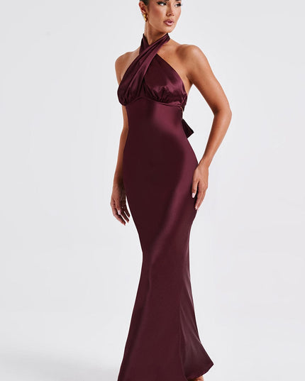 Front view of a women's formal halter neck maxi dress in deep burgundy, with gathered bust detail and a sleek fit.