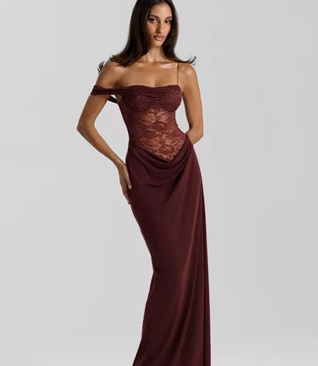 Front view of a woman posing in a deep red off-shoulder lace corset maxi dress with elegant draping.