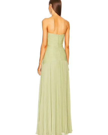 Rear view of a women's light green formal strapless maxi dress, highlighting the pleated details of the skirt.