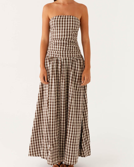 Front view of women's brown and white gingham strapless ruched maxi dress, full length