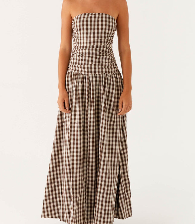 Front view of women's brown and white gingham strapless ruched maxi dress, full length