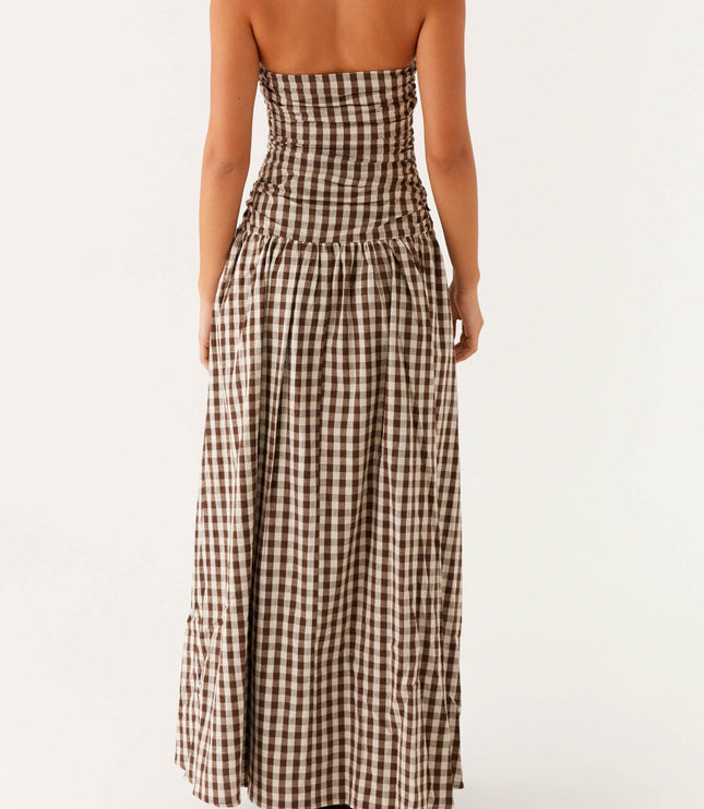 Back view of women's brown and white gingham strapless ruched maxi dress, full length