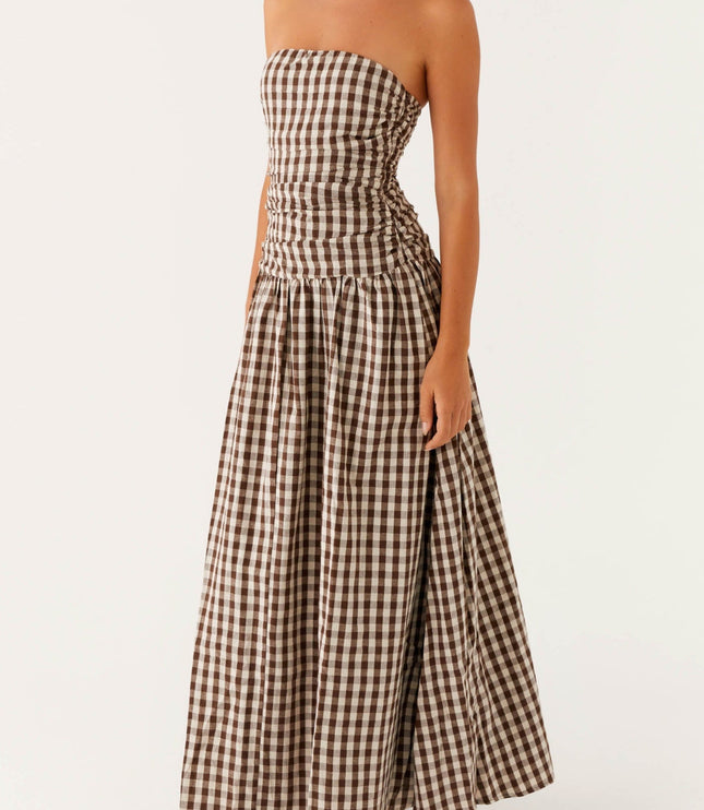 Women's brown and white gingham strapless maxi dress with ruched bodice, side view