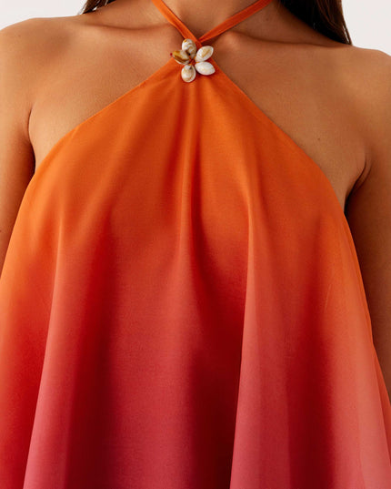 Close-up of the neckline of the ombre layered chiffon mini dress, highlighting the halter neck and decorative shell detail.