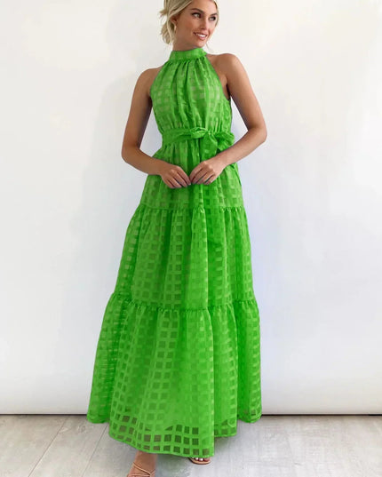 Bright green halter neck tiered maxi dress, showcasing a checkered pattern and a self-tie belt, for spring.