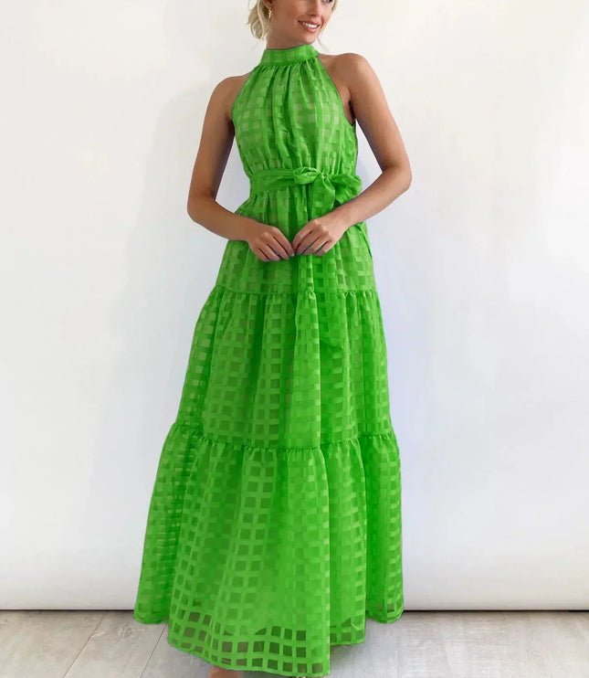 Bright green halter neck tiered maxi dress, showcasing a checkered pattern and a self-tie belt, for spring.