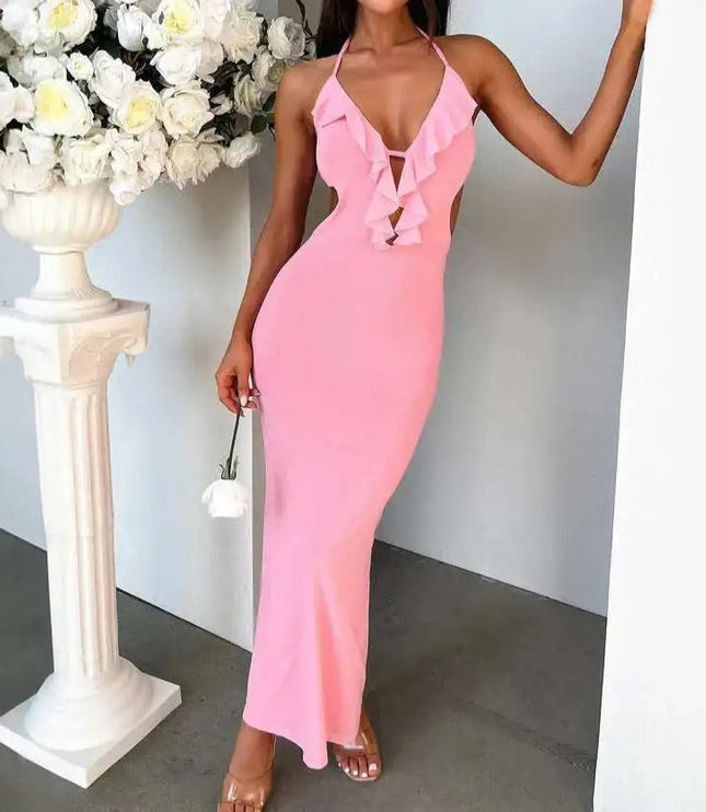 Full length view of a pink halter ruffle cut out backless maxi dress, showcasing the elegant fit and ruffles.