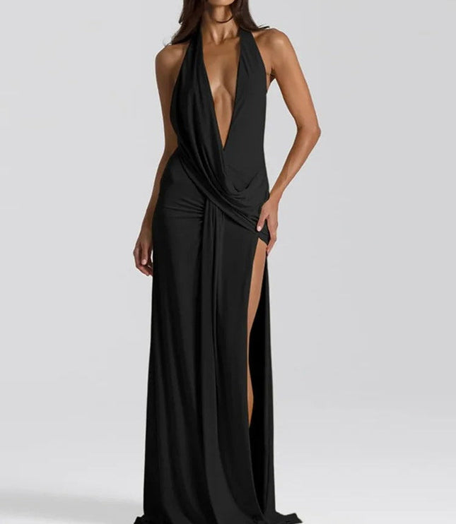 Black halter v-neck backless maxi dress with deep plunging neckline and ruched side slit detail.