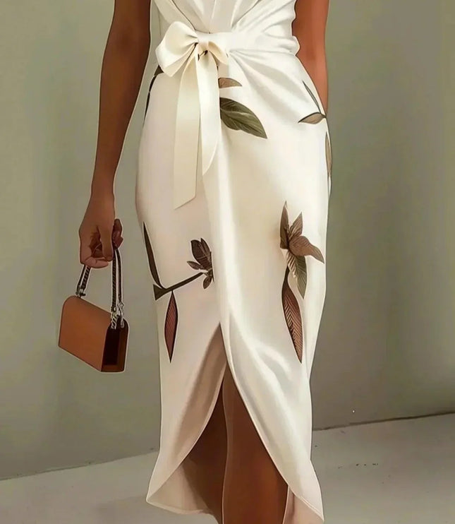 Side view of a women's white leaf print v-neck short sleeve midi wrap dress, showcasing the flowy skirt and purse.