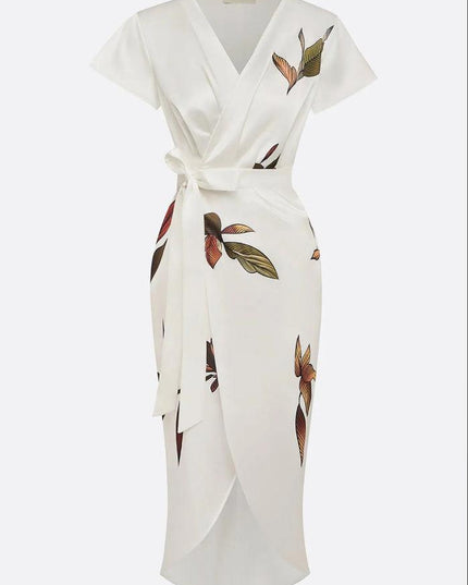 Studio shot of the white leaf print v-neck short sleeve midi wrap dress, displaying the full garment on a hanger.