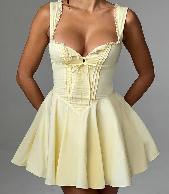 Close-up front view of a lemon yellow mini dress, highlighting the pintuck bodice and lace trim details.