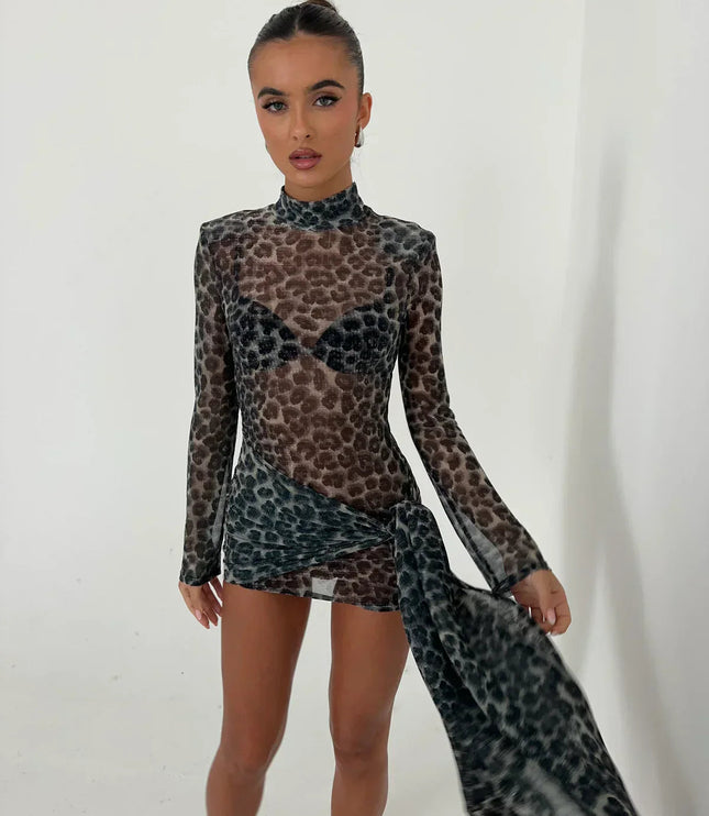 Close up front view of women's dark leopard print high neck ruched mini dress, sheer fabric and detailing.