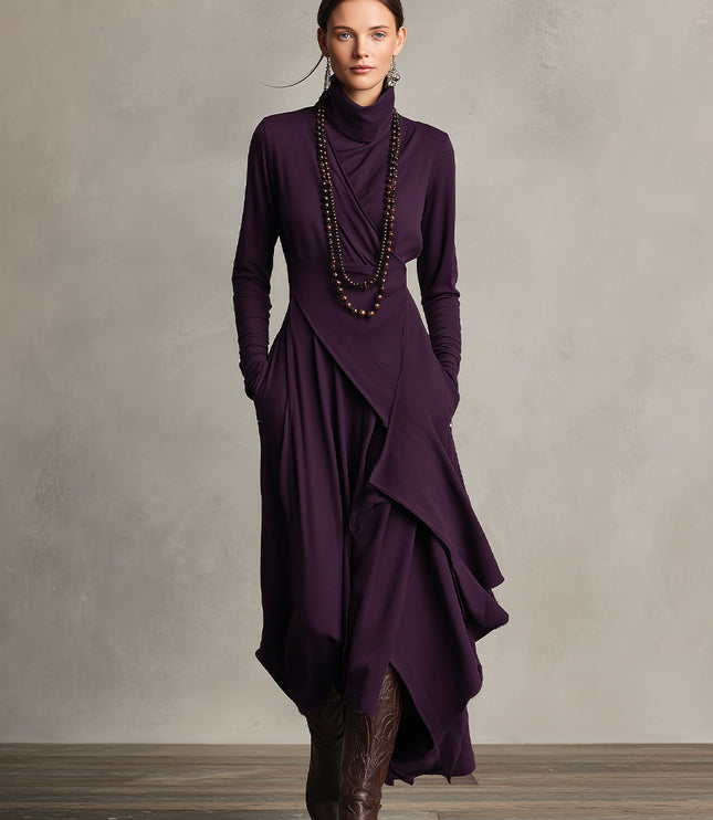 Front view of the plum long sleeve midi dress, showcasing the elegant drape and practical pockets, paired with boots.