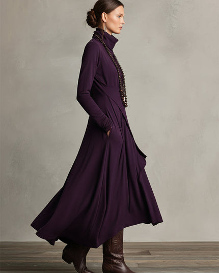 Side profile of the plum long sleeve midi dress, showing the movement and layered drape of the skirt.