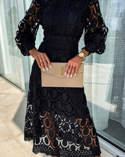 Stylish black long sleeve lace high neck midi dress with bold circular lace patterns and sheer sleeves