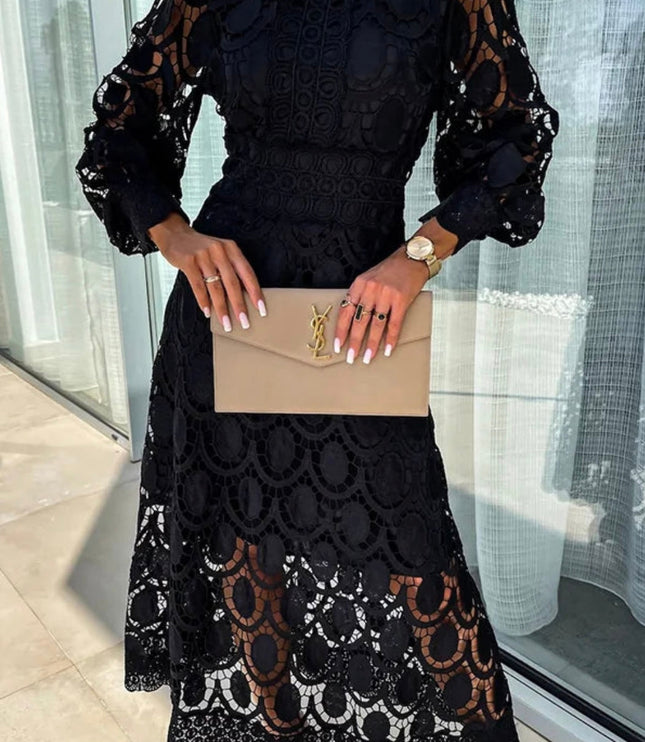 Stylish black long sleeve lace high neck midi dress with bold circular lace patterns and sheer sleeves