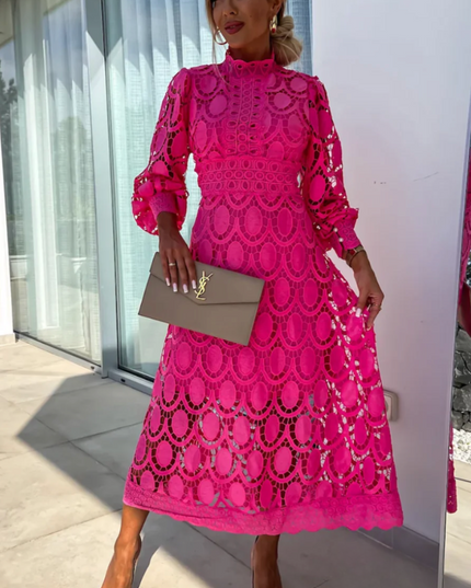 Vibrant fuchsia pink long sleeve lace high neck midi dress with intricate circular patterns and puff sleeves
