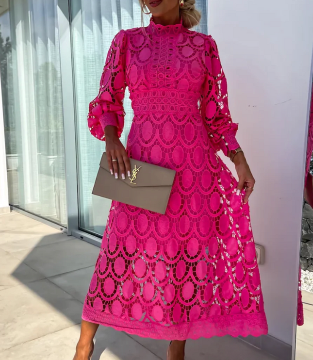 Vibrant fuchsia pink long sleeve lace high neck midi dress with intricate circular patterns and puff sleeves